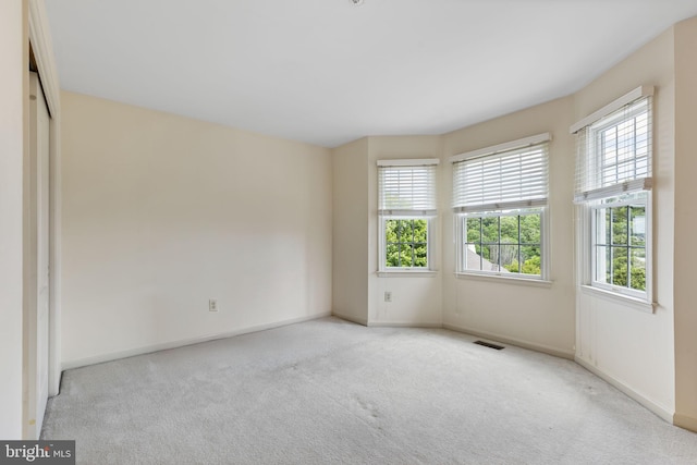 1015 Riverview Ln, Conshohocken, PA 19428 - carpeted empty room featuring plenty of natural light and baseboards
