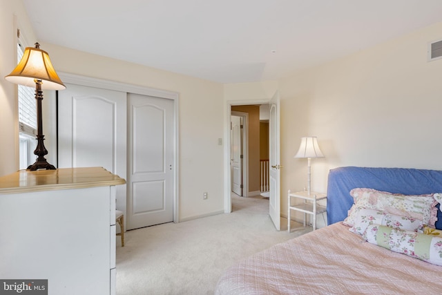 1015 Riverview Ln, Conshohocken, PA 19428 - bedroom with light carpet, baseboards, and a closet