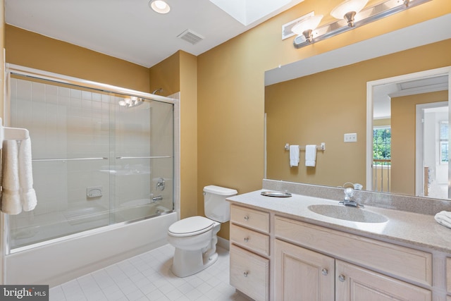 1015 Riverview Ln, Conshohocken, PA 19428 - bathroom with toilet, vanity, tile patterned floors, and bath / shower combo with glass door