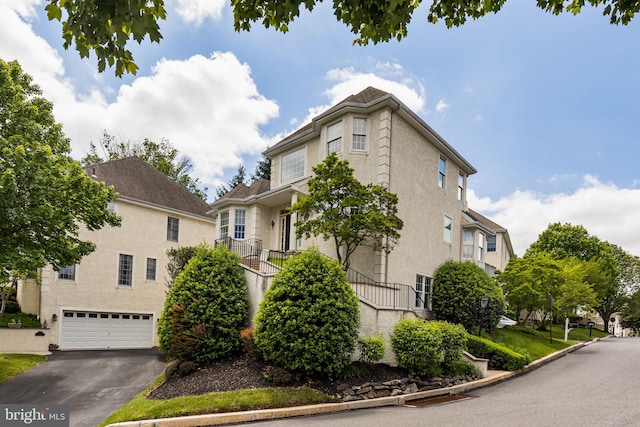 1015 Riverview Ln, Conshohocken, PA 19428 - view of front of house featuring an attached garage and asphalt driveway