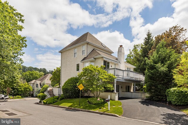 1015 Riverview Ln, Conshohocken, PA 19428 - view of front of home with a chimney and stucco siding