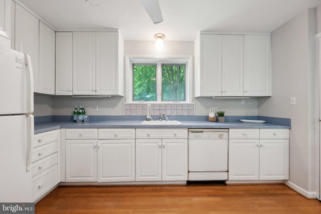 3538 Yuma St NW, Washington, DC 20008 - kitchen with white appliances, a sink, and white cabinets