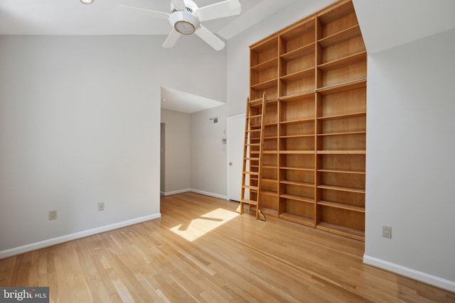 3538 Yuma St NW, Washington, DC 20008 - empty room with wood finished floors, a ceiling fan, baseboards, and a high ceiling