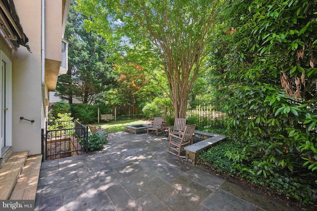 3538 Yuma St NW, Washington, DC 20008 - view of patio featuring an outdoor fire pit