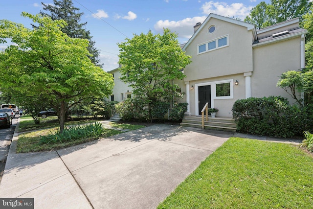 3538 Yuma St NW, Washington, DC 20008 - view of front of house with stucco siding and a front yard