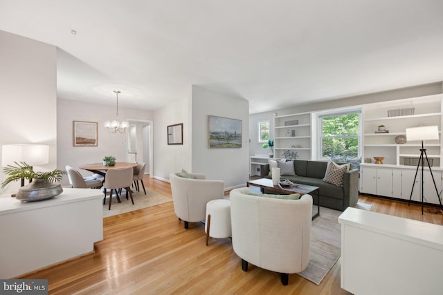 3538 Yuma St NW, Washington, DC 20008 - living room featuring light wood finished floors and a chandelier