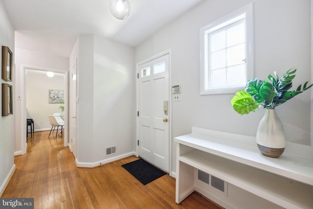 3538 Yuma St NW, Washington, DC 20008 - foyer entrance with light wood-style flooring and baseboards
