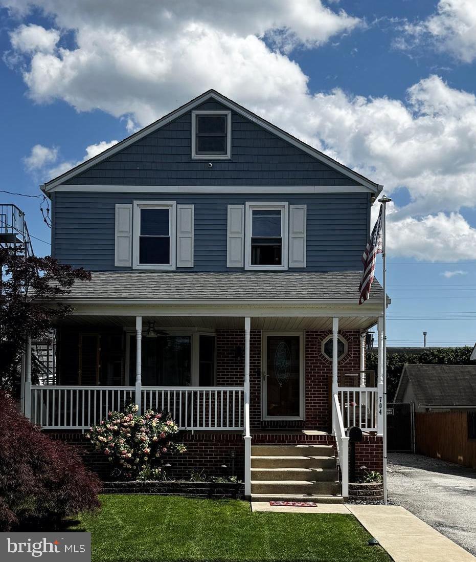 704 13th Ave, Prospect Park, PA 19076 - traditional style home featuring covered porch and brick siding