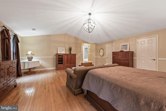 6323 Colchester Rd, Fairfax Station, VA 22039 - bedroom featuring light wood-type flooring, a chandelier, lofted ceiling, and baseboards