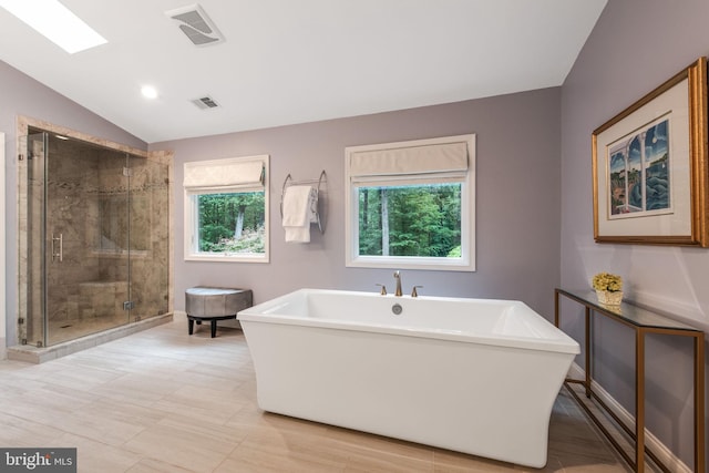 6323 Colchester Rd, Fairfax Station, VA 22039 - bathroom with a soaking tub, a stall shower, lofted ceiling, and baseboards