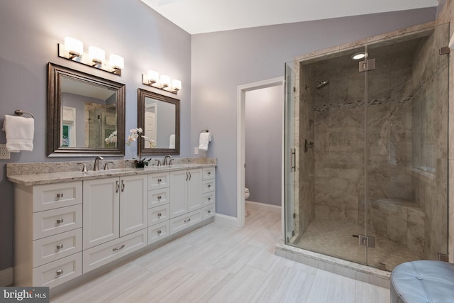 6323 Colchester Rd, Fairfax Station, VA 22039 - bathroom with double vanity, a shower stall, toilet, and baseboards