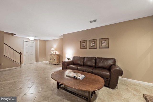 6323 Colchester Rd, Fairfax Station, VA 22039 - living area with stairs, baseboards, and light tile patterned floors