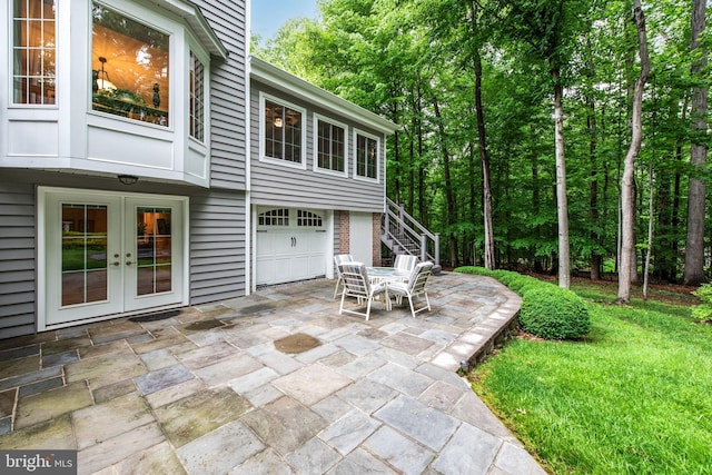 6323 Colchester Rd, Fairfax Station, VA 22039 - view of patio / terrace featuring a garage, french doors, and stairway