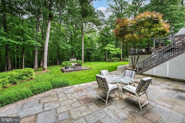 6323 Colchester Rd, Fairfax Station, VA 22039 - view of patio with stairway, outdoor dining space, a fire pit, and a deck