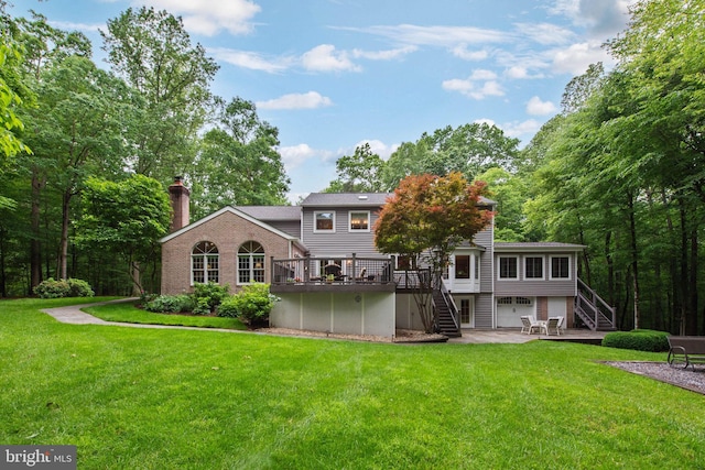 6323 Colchester Rd, Fairfax Station, VA 22039 - back of house with stairway, a garage, a deck, a chimney, and a yard