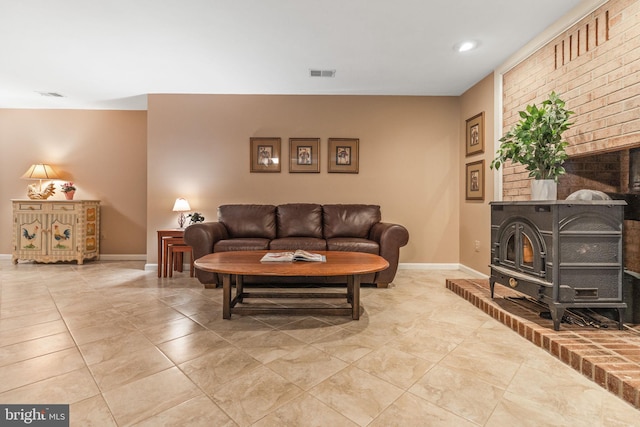 6323 Colchester Rd, Fairfax Station, VA 22039 - living room featuring a wood stove, baseboards, and recessed lighting
