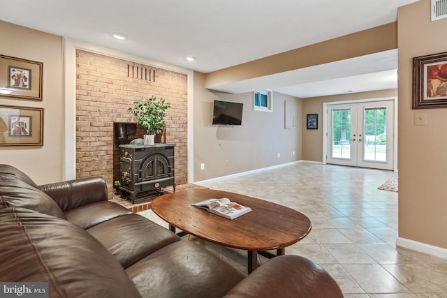 6323 Colchester Rd, Fairfax Station, VA 22039 - living room featuring a wood stove, baseboards, french doors, light tile patterned floors, and recessed lighting