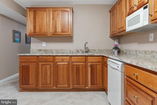 6323 Colchester Rd, Fairfax Station, VA 22039 - kitchen featuring white appliances, a sink, and light stone counters