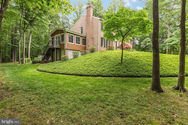 6323 Colchester Rd, Fairfax Station, VA 22039 - view of green lawn featuring stairway and a wooden deck