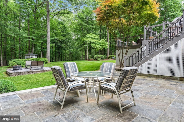 6323 Colchester Rd, Fairfax Station, VA 22039 - view of patio / terrace with stairway, an outdoor fire pit, and outdoor dining area