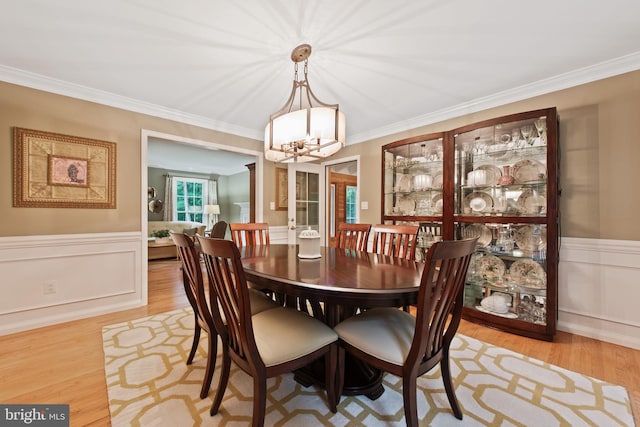 6323 Colchester Rd, Fairfax Station, VA 22039 - dining space with a chandelier, wood finished floors, wainscoting, and crown molding