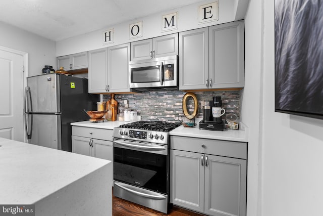 1420 V St SE, Washington, DC 20020 - kitchen with stainless steel appliances, gray cabinetry, and light countertops