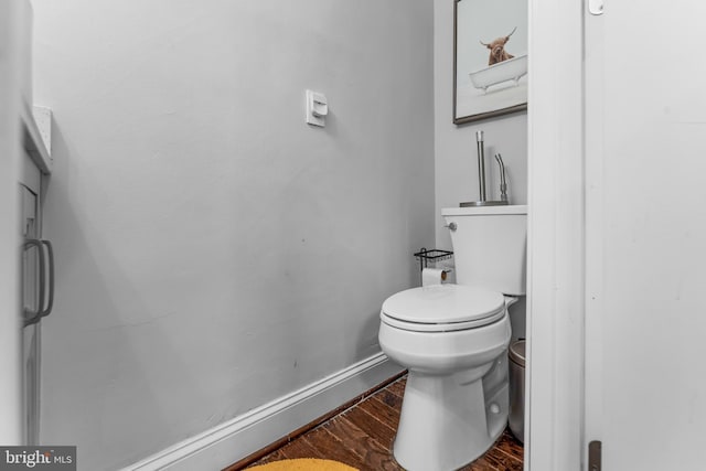 1420 V St SE, Washington, DC 20020 - bathroom with wood finished floors, toilet, and baseboards