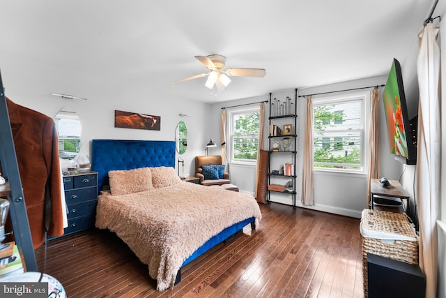 1420 V St SE, Washington, DC 20020 - bedroom with dark wood-style flooring, ceiling fan, and baseboards