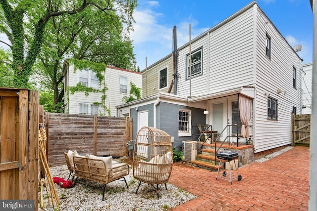 1420 V St SE, Washington, DC 20020 - back of house with a patio, a fenced backyard, and cooling unit