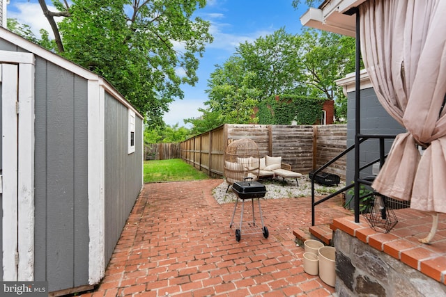 1420 V St SE, Washington, DC 20020 - fenced backyard with a patio, grilling area, and an outdoor hangout area