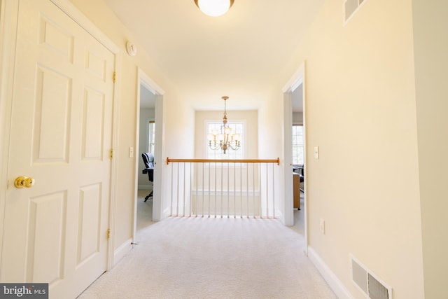 5110 Maple Leaf Ct, Mechanicsburg, PA 17055 - hall featuring a chandelier, light colored carpet, and baseboards