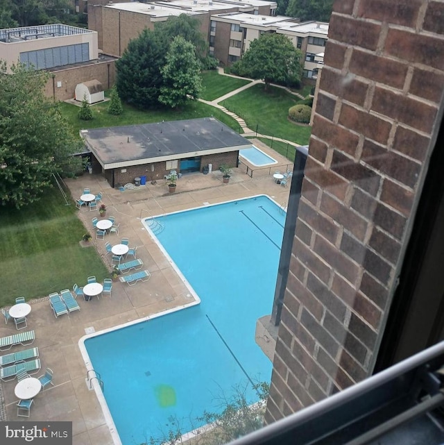 9900 Georgia Ave Unit 27-709, Silver Spring, MD 20902 - community pool with a patio area and a yard