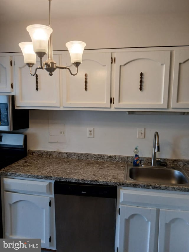 9900 Georgia Ave Unit 27-709, Silver Spring, MD 20902 - kitchen featuring appliances with stainless steel finishes, a sink, white cabinetry, and pendant lighting