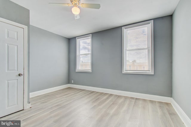 2726 E Preston St, Baltimore, MD 21213 - spare room featuring light wood-style flooring, baseboards, and ceiling fan