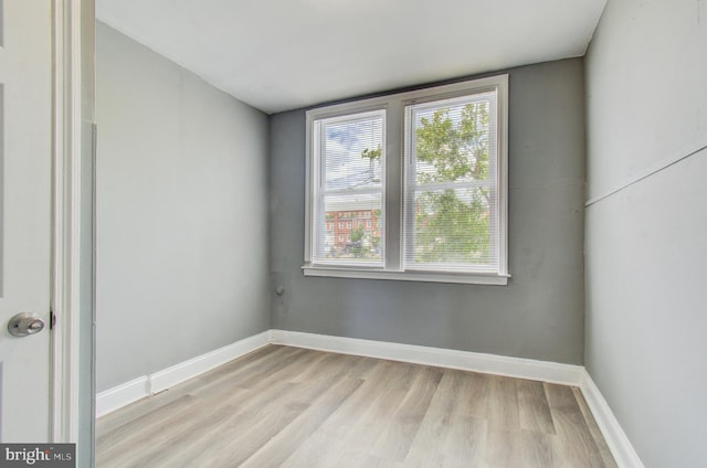 2726 E Preston St, Baltimore, MD 21213 - spare room featuring light wood finished floors and baseboards