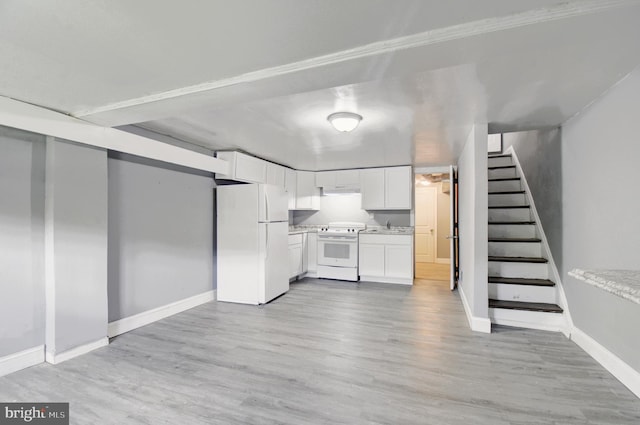 2726 E Preston St, Baltimore, MD 21213 - finished below grade area with freestanding refrigerator, stairs, baseboards, light wood-type flooring, and a sink
