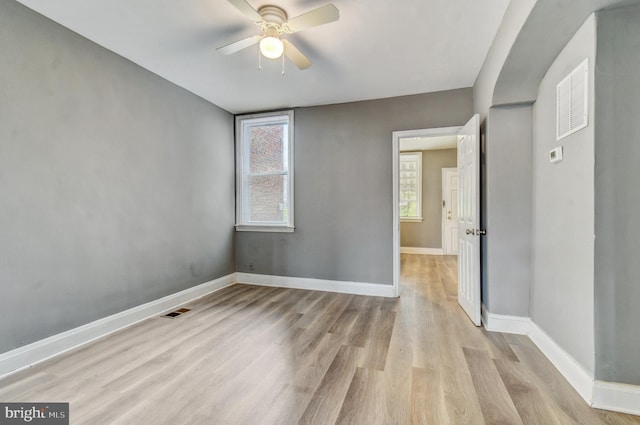 2726 E Preston St, Baltimore, MD 21213 - unfurnished room featuring a ceiling fan, light wood-style floors, and baseboards