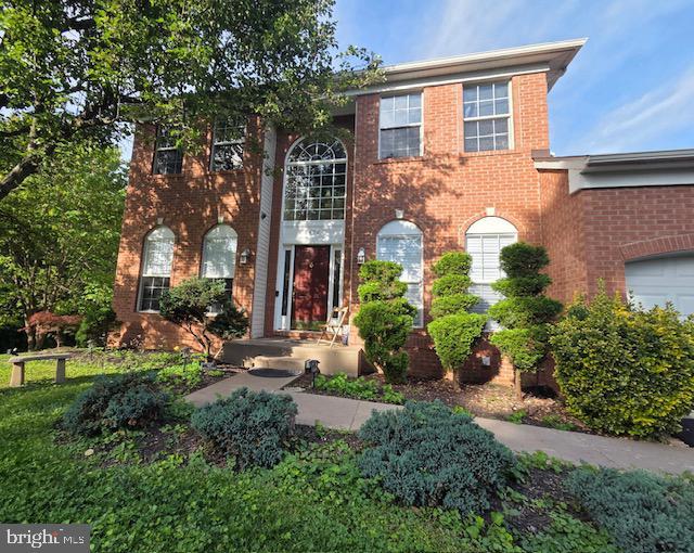 8456 Summer Breeze Pl, Manassas, VA 20112 - view of front of home with brick siding and an attached garage