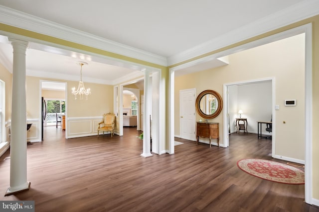8456 Summer Breeze Pl, Manassas, VA 20112 - entryway featuring ornate columns, dark wood finished floors, crown molding, a chandelier, and a wainscoted wall