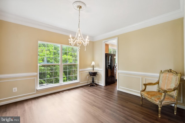 8456 Summer Breeze Pl, Manassas, VA 20112 - living area with a chandelier, ornamental molding, dark wood-style floors, a wainscoted wall, and a decorative wall