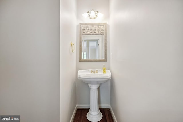 8456 Summer Breeze Pl, Manassas, VA 20112 - bathroom with baseboards and wood finished floors