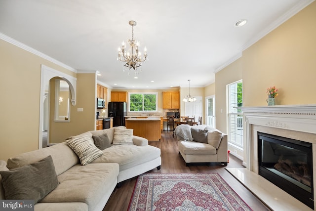 8456 Summer Breeze Pl, Manassas, VA 20112 - living area with a chandelier, plenty of natural light, dark wood-type flooring, recessed lighting, and ornamental molding