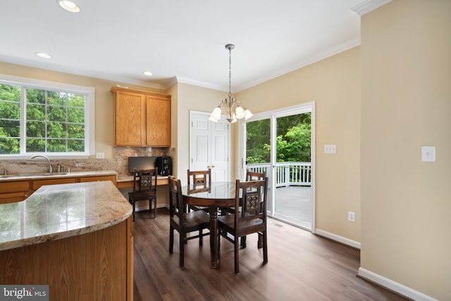 8456 Summer Breeze Pl, Manassas, VA 20112 - dining area with a chandelier, ornamental molding, dark wood-type flooring, baseboards, and recessed lighting