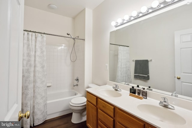 8456 Summer Breeze Pl, Manassas, VA 20112 - full bath featuring double vanity, shower / bath combo, toilet, and wood finished floors
