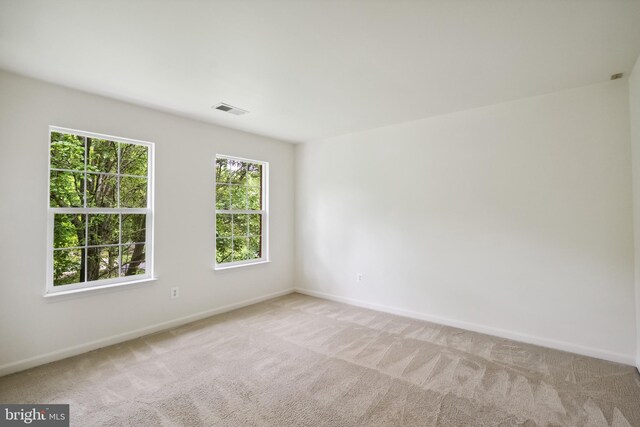 8456 Summer Breeze Pl, Manassas, VA 20112 - spare room with light carpet and baseboards