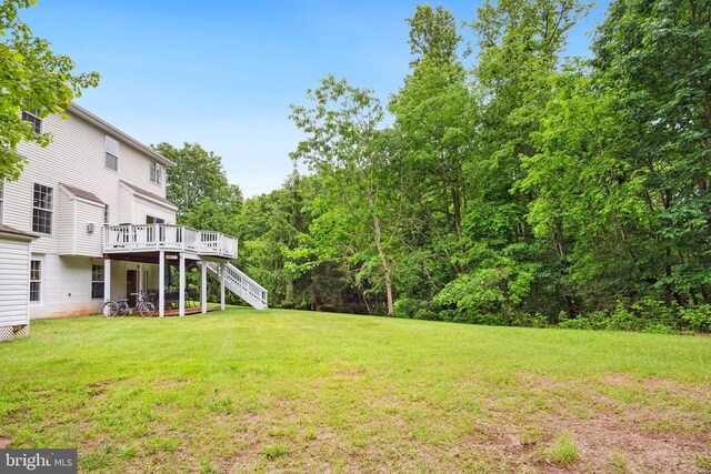 8456 Summer Breeze Pl, Manassas, VA 20112 - view of green lawn with stairs and a deck