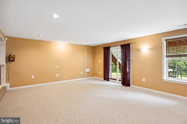 8456 Summer Breeze Pl, Manassas, VA 20112 - unfurnished living room with light carpet, baseboards, and recessed lighting