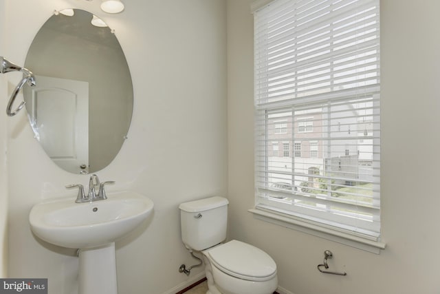 22672 Flowing Spring Sq, Brambleton, VA 20148 - bathroom featuring toilet and baseboards