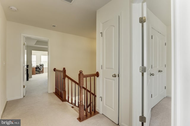22672 Flowing Spring Sq, Brambleton, VA 20148 - hall with an upstairs landing, light carpet, and baseboards