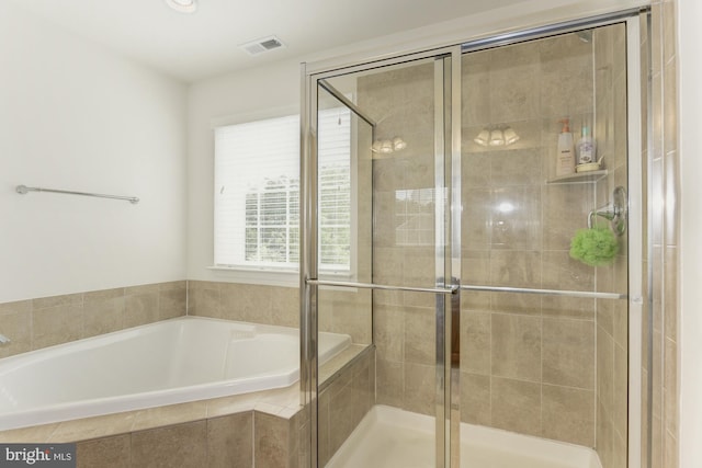 22672 Flowing Spring Sq, Brambleton, VA 20148 - bathroom with a bath and a shower stall